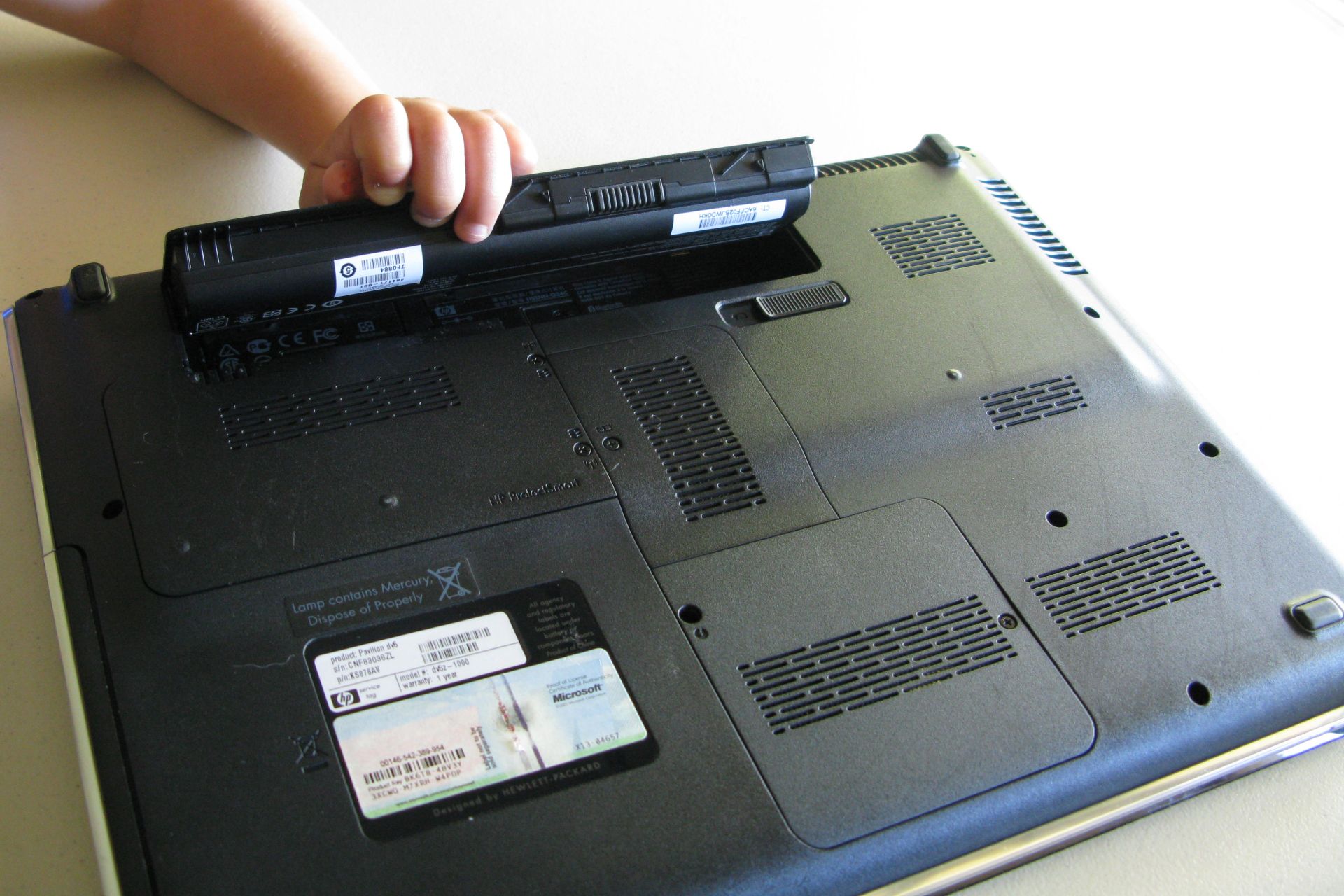 Laptop battery being removed